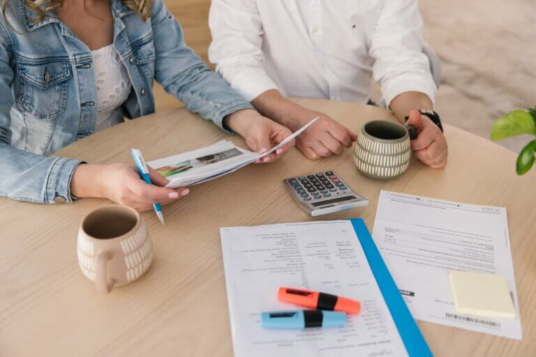 A young couple assesing their debt considering debt consolidation
