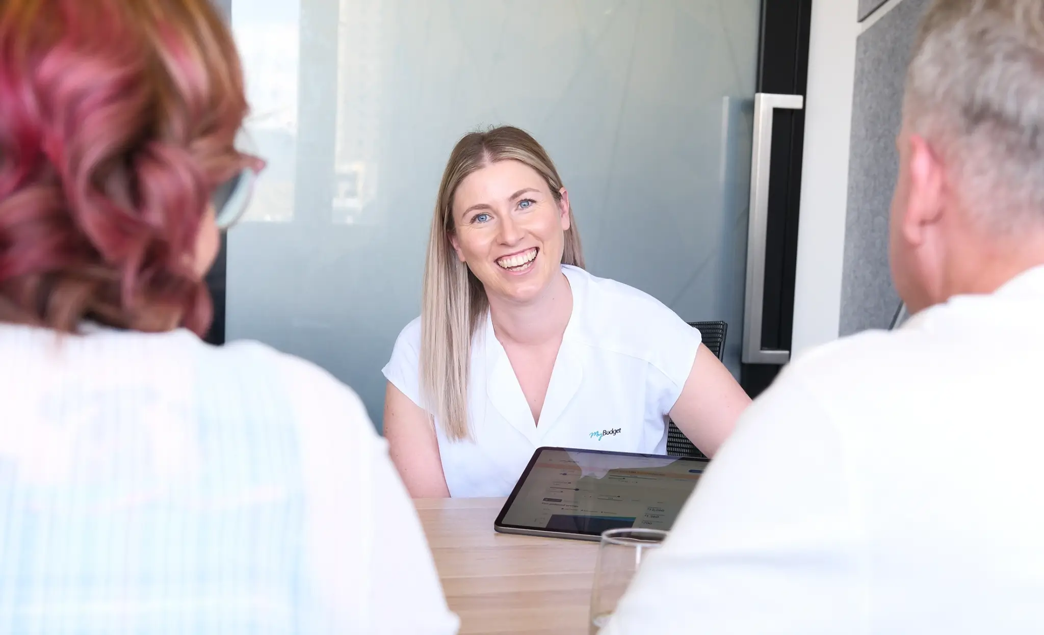 Tara, a dedicated MyBudget team member, providing financial coaching and debt solutions during a client appointment in New Zealand.