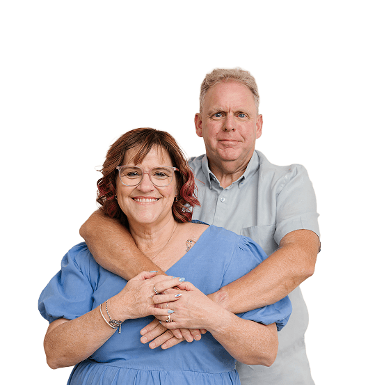 Two MyBudget's clients, Michelle and Phil, smiling and looking at the camera